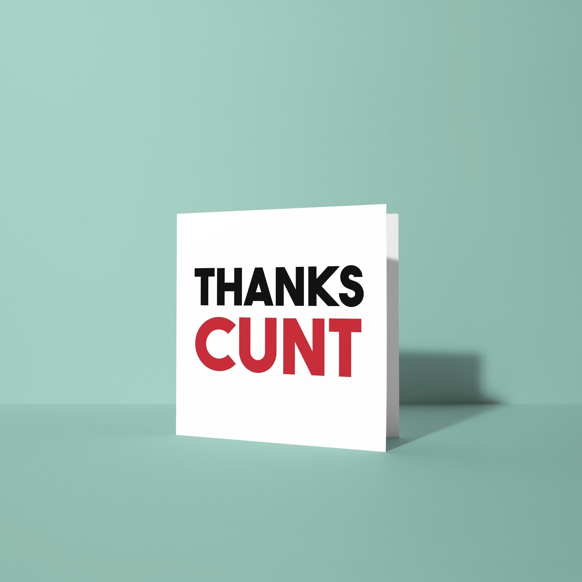 Card with 'THANKS CUNT' text on a light green background