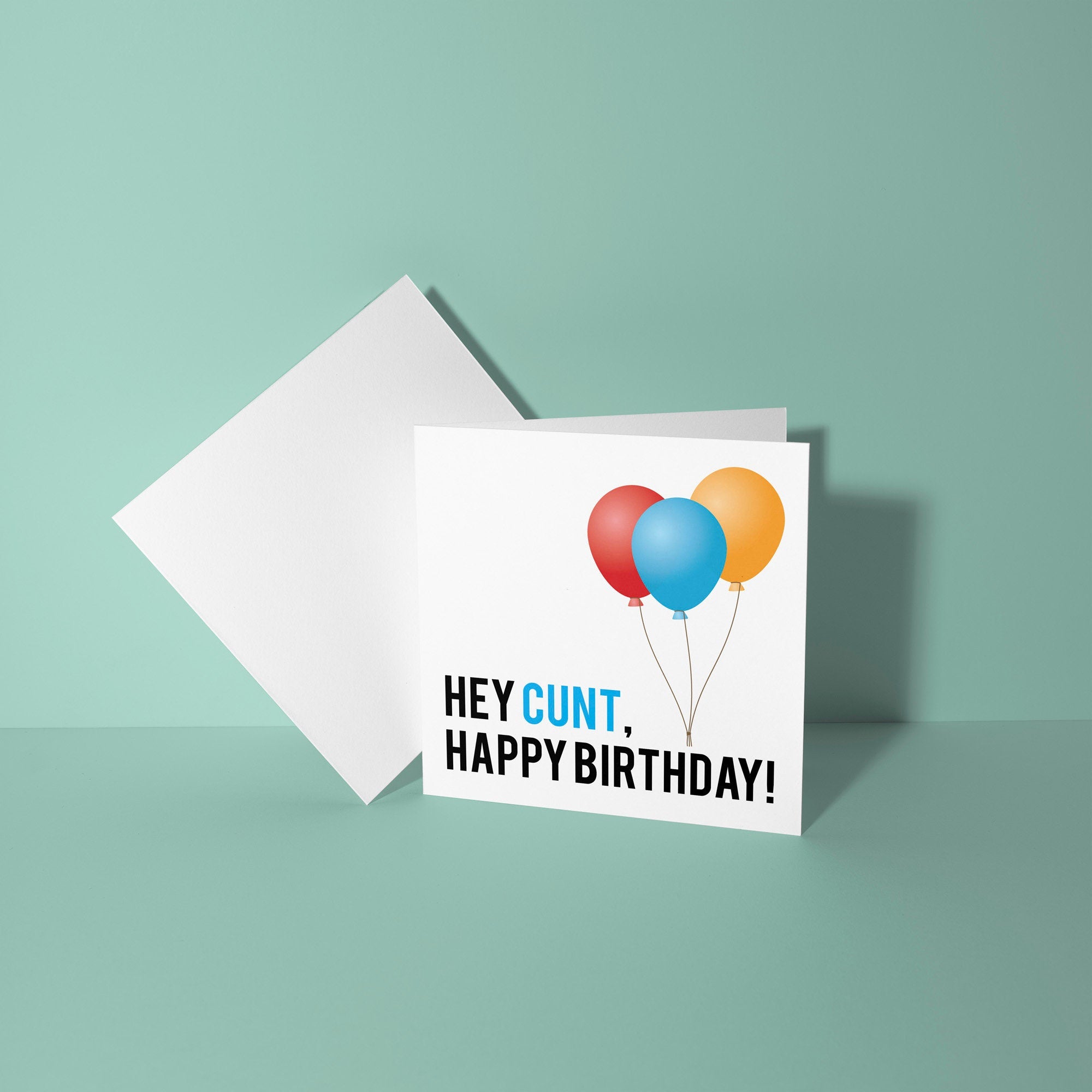 Greeting card with colorful balloons and text on a light green background