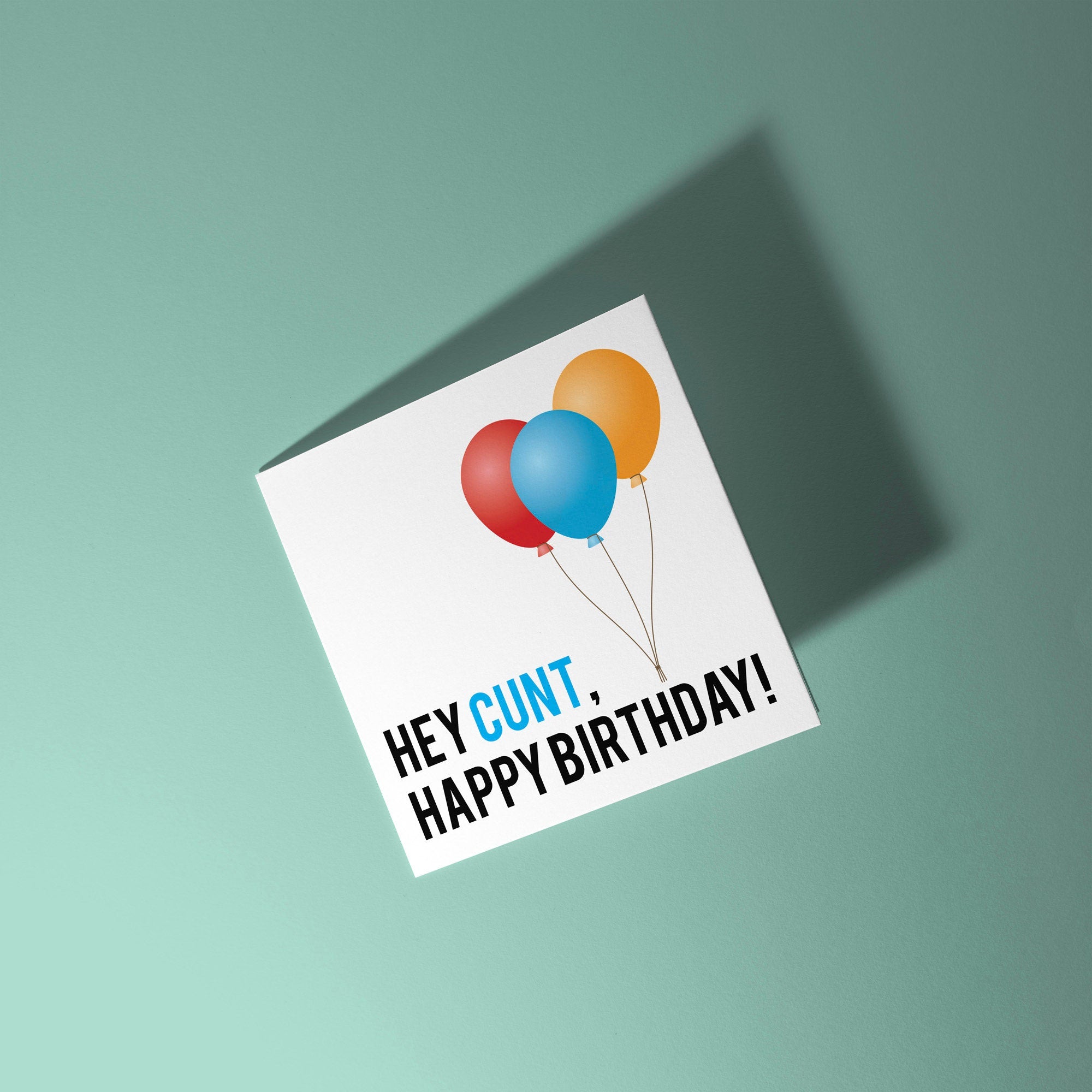 Greeting card with colorful balloons and text on a light green background